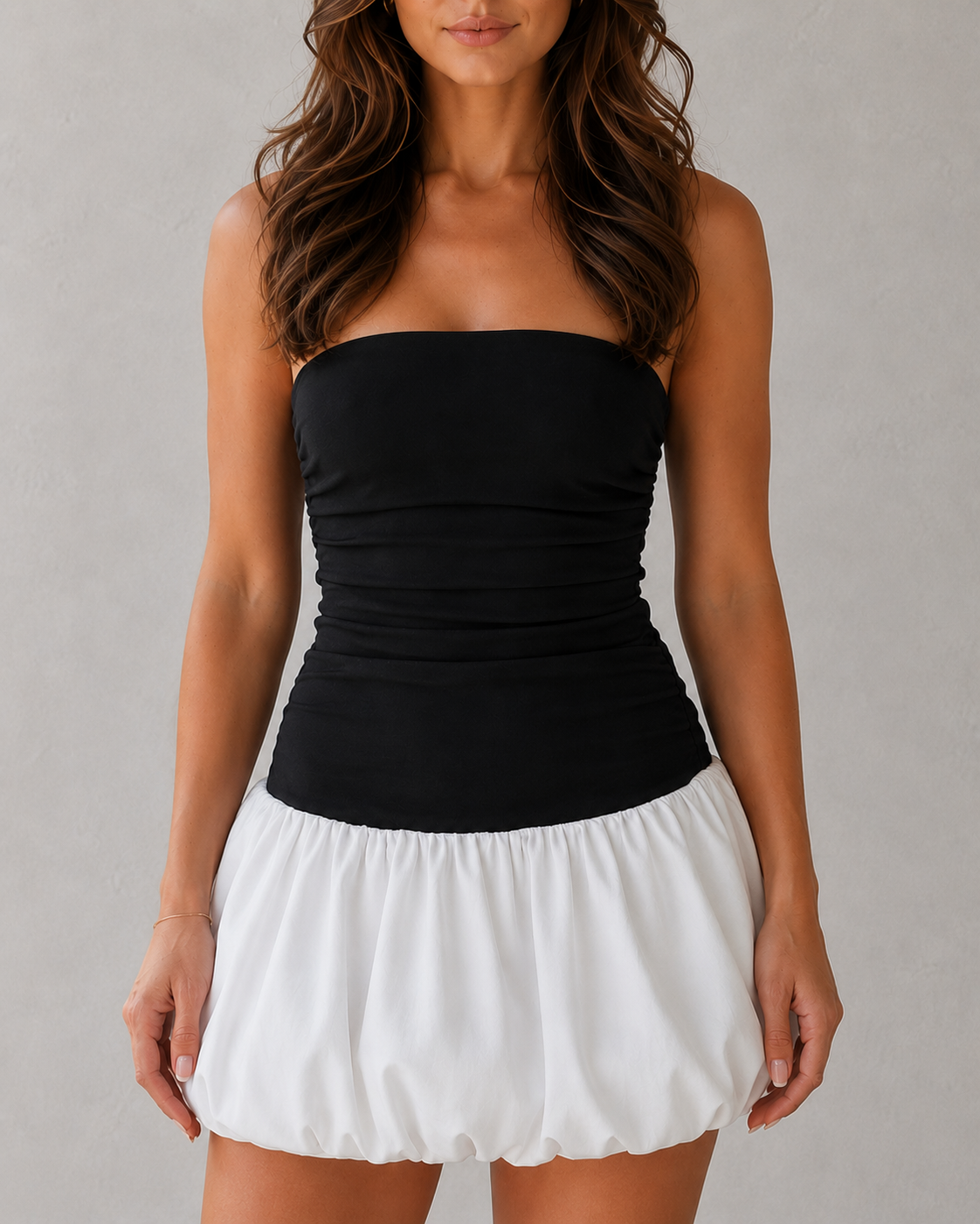 Women's strapless stretch crepe mini dress with a fitted pleated bodice, dropped waist, and voluminous puffball skirt, designed for parties, cocktail events, and special occasions.