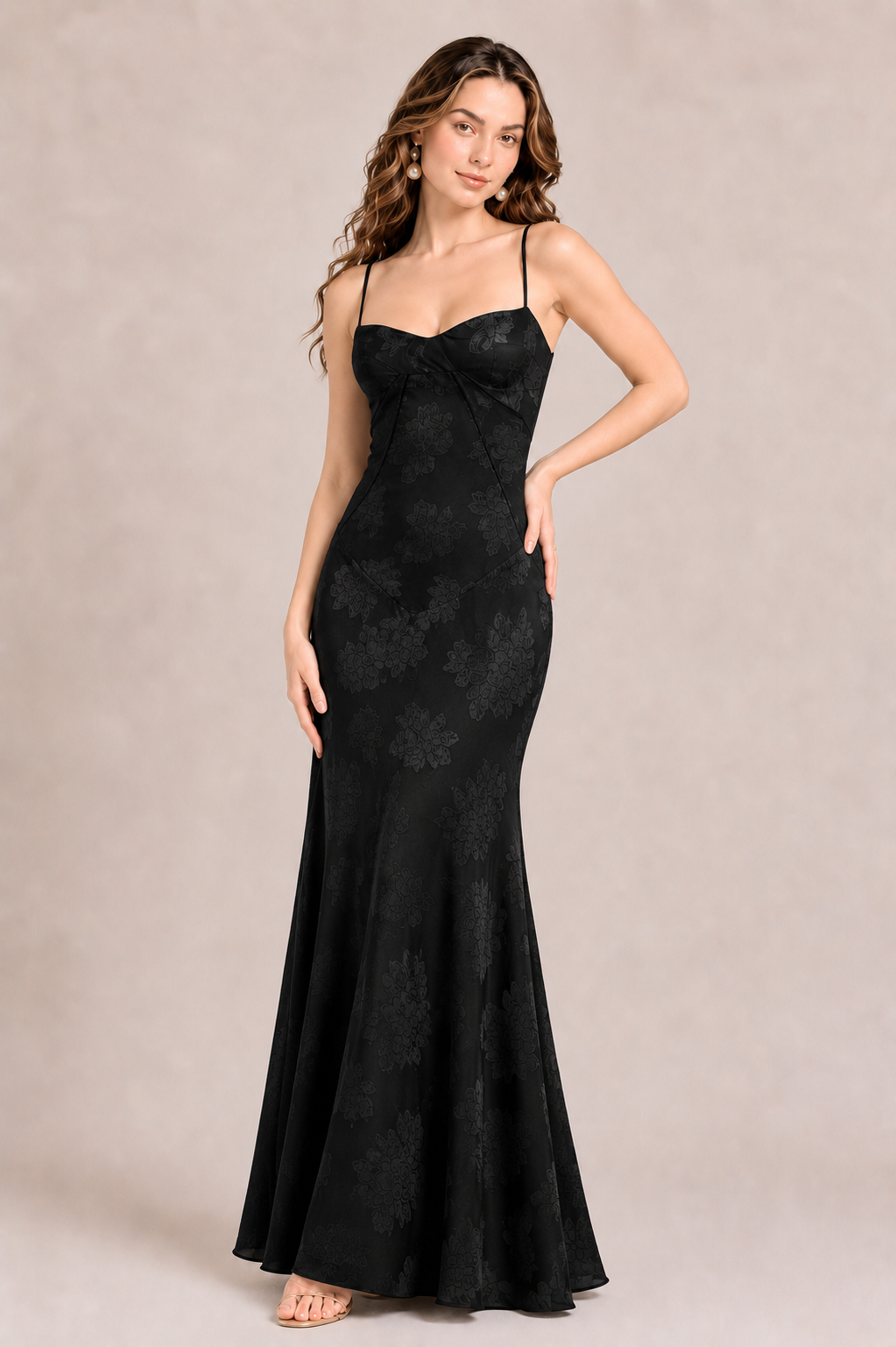 Woman wearing an elegant sweetheart neckline maxi dress with a fitted waist and flowing floor-length skirt, creating a timeless feminine silhouette ideal for weddings, parties, holidays, and special occasions.