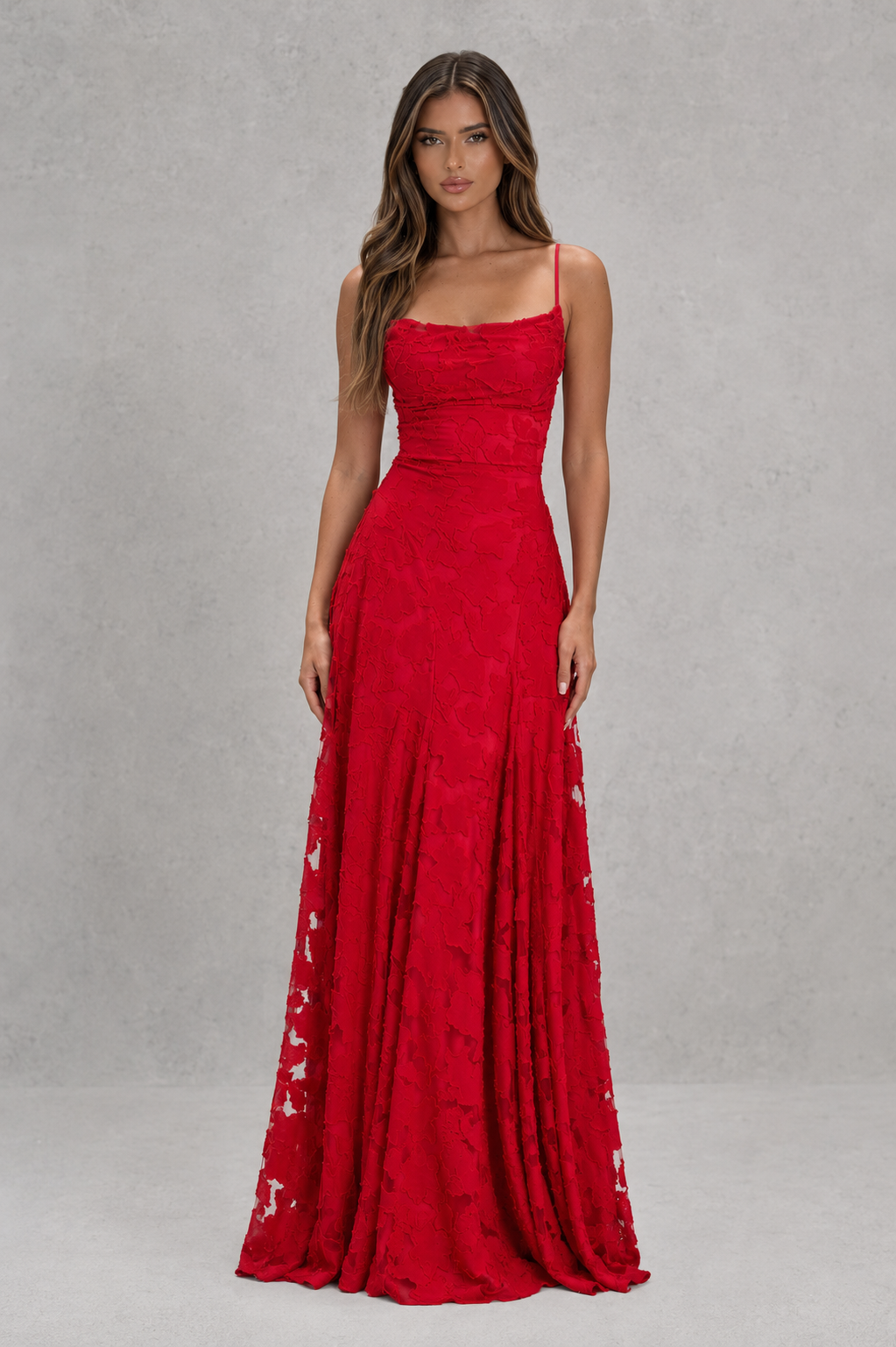 Women’s textured floral maxi dress with delicate shoulder straps, sculpted fitted bodice, defined waist, and flowing full-length skirt.