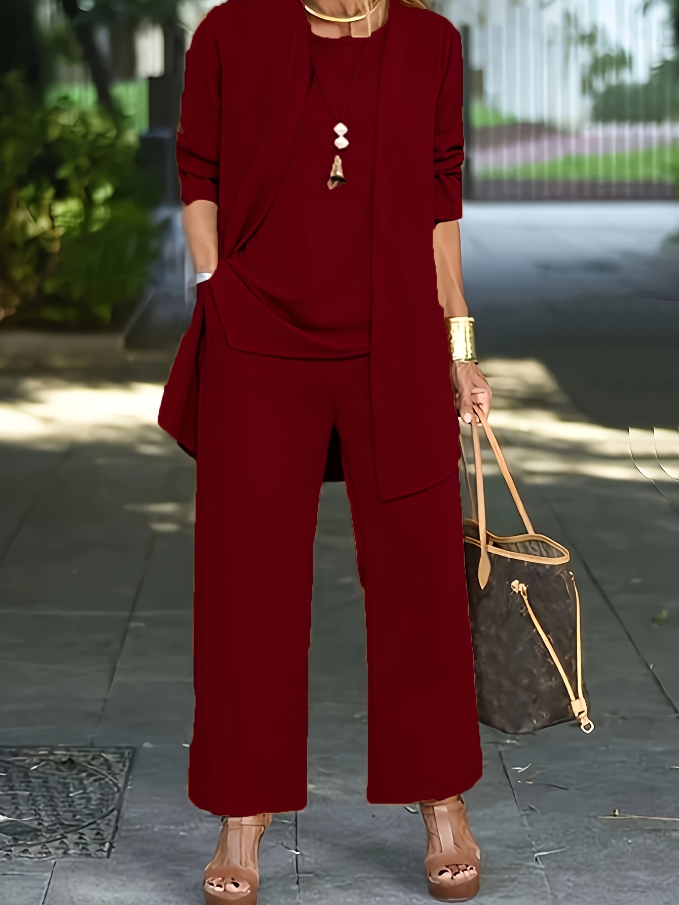 Women’s three-piece outfit set with vest, fitted top, and pants
