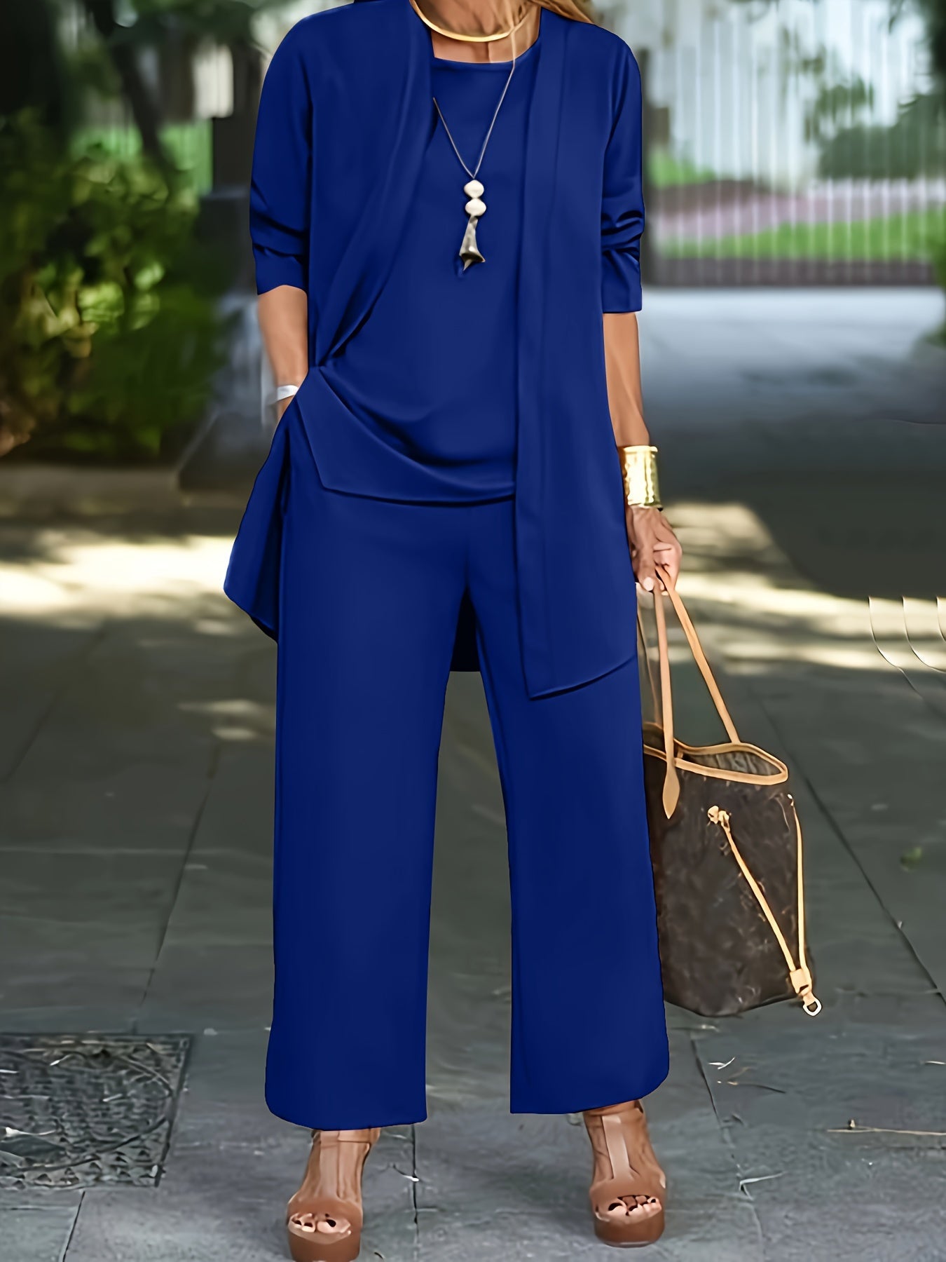 Women’s three-piece outfit set with vest, fitted top, and pants