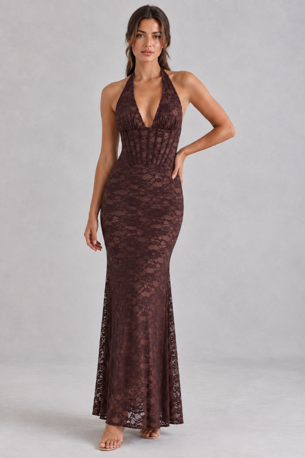 Woman wearing a brown lace corset maxi dress with halter V-neck, ideal for formal events.